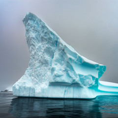 rock iceberg blue color in Antarctica