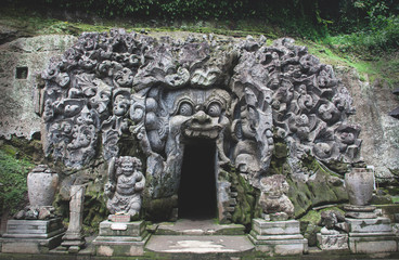 High angle Goa Gajah temple tomb entrance - engraved stone