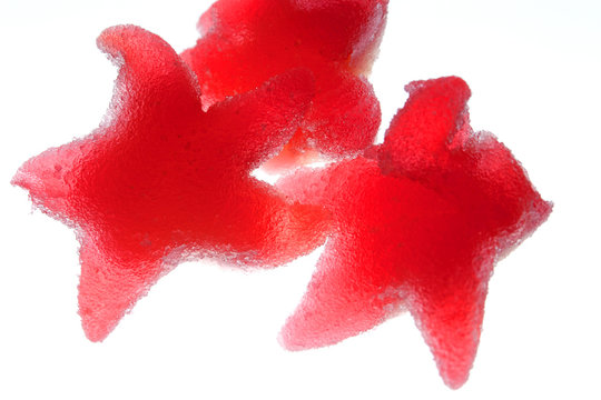 Red sugar stars on a white background