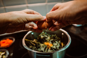 .Middle-aged woman preparing a healthy pizza based on fresh food. Cooking at home relaxed and unhurried. Stay home