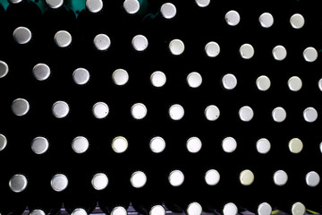 Aerial view of a group of capped beer bottles placed in line