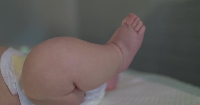 Close view of changing the diaper of newborn