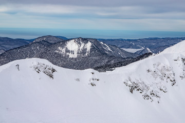 Fototapeta na wymiar View from Mountain peak in the area of Krasnaya Polyana in Sochi