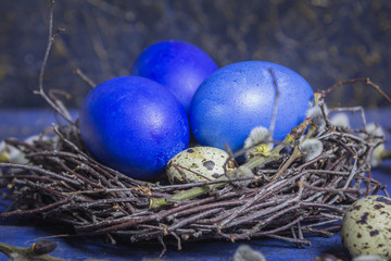 Fototapeta na wymiar Blue Easter eggs on vibrant wooden table background
