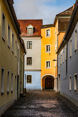 Fototapeta na wymiar Sunny and colorful houses in the historic center of Regensburg