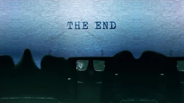 The End words Word closeup Being Typing and Centered on a Sheet of paper on old vintage Typewriter mechanical 4k Footage Background Animation.