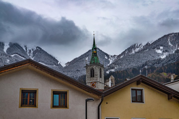 Fototapeta na wymiar urban landscape with views of the church and mountains in the vicinity of Schwaz