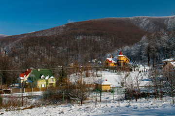 Snow-covered winter village in the Carpathian mountains
