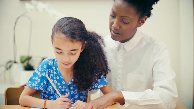 Young girl home schooling. Self isolation  during Covid-19 crisis