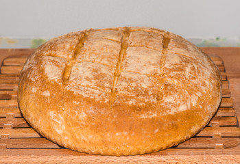 Freshly baked home made bread on board.