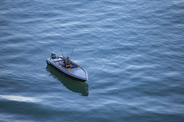Naklejka premium Venice, Italy - angler in the boat in the morning