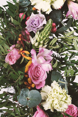 Floral background. Different flowers close-up vertical.