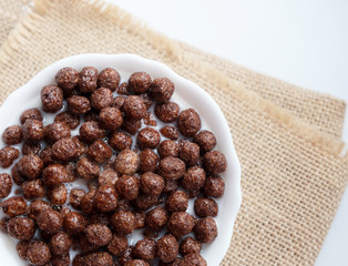 Chocolate balls with milk in a white plate
