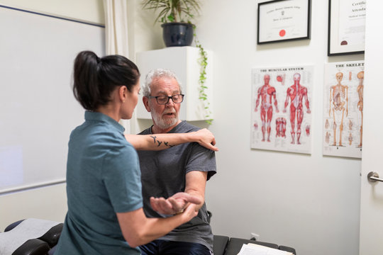 Natural Medicine Practitioner Assessing Client