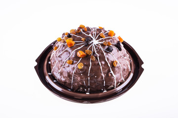 Nut cake with dried fruit in the package, with chocolate glaze