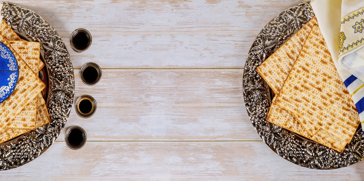 Matzos of Passover celebration with matzo unleavened bread on kiddush cup of wine