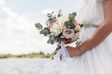 the bride bouquet close-up of lake