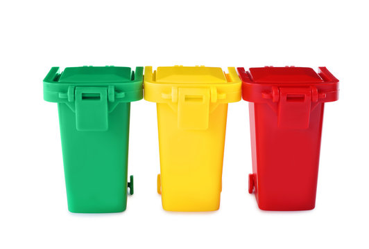 Mini color recycling bins on white background