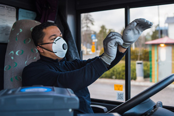 busdriver wears a face mask to protect himself from the coronavirus epidemic. Pandemic coronavirus 2020. Quarantine.Virus concept. Epidemic infection.