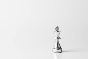 lonely king chess standing on white background.