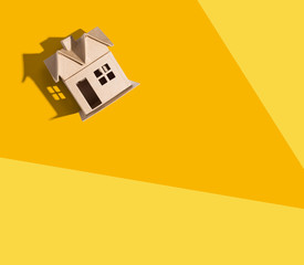 Cardboard house with drop shadow overhead view