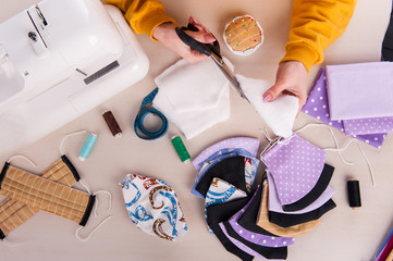 The manufacturing process of protective medical face masks. Protective medical face masks lie on...