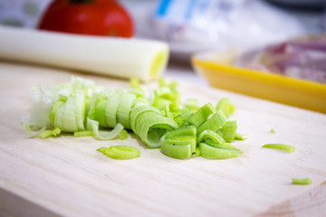 Sliced leek on a wooden cutting board
