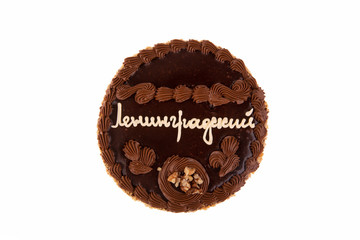 Cake with chocolate cream and nuts in packaging