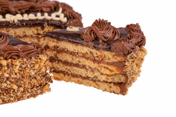 Piece of cake with chocolate cream and nuts