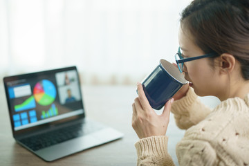 Woman using laptop making video call to partner, looking at screen with conference. work from home.
