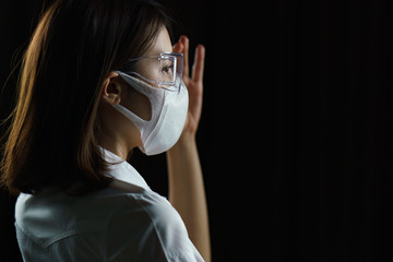 Woman wearing safety glasses and mask, to avoid the spread of coronavirus.