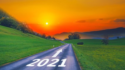 Empty open asphalt road and New year 2021 concept. Driving on empty road goals against sun in...