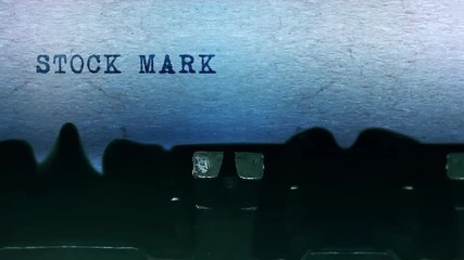 Stock Market Word closeup Being Typing and Centered on a Sheet of paper on old vintage Typewriter mechanical 4k Footage Background Animation. - Powered by Adobe