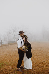 stylish young couple of brides photographed outdoors in the mountains