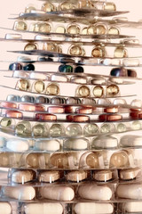 Concept of healthcare, medicine, pharmacy, drugs. Assortment of medicinal pharmaceutical products, tablets, pills, capsules in blister packaging. Treatment and prevention of diseases, light background