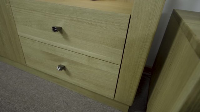 Shelves shiny knobs from beautiful minimalistic chest of drawers open smoothly