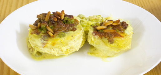 Cooked artichokes and stuffed with meat, cheese and pine nuts.