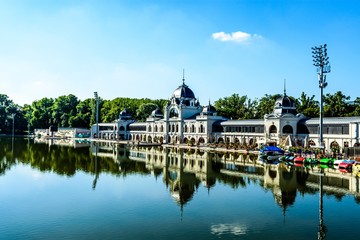 Fototapeta premium Boating lake in Main City Park in Budapest, Hungary. With blue sky, clouds. 