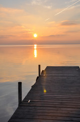 Sunset at pier in the Natural Park of the Albufera in Valencia