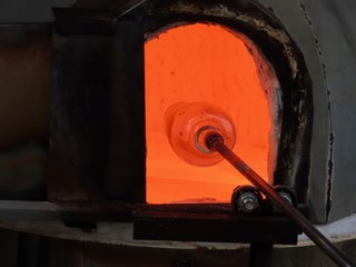 Glass blowing in furnace