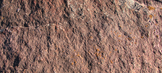 Stone texture of pink shade. Natural stone, closeup.