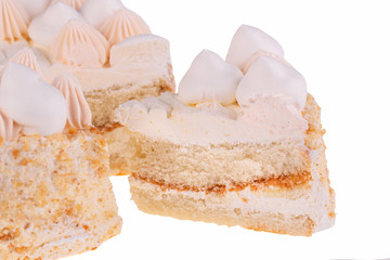 A piece of cream cake with vanilla cream on a white background