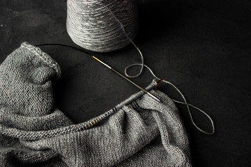 Fototapeta na wymiar Knitting on silver thread needles
