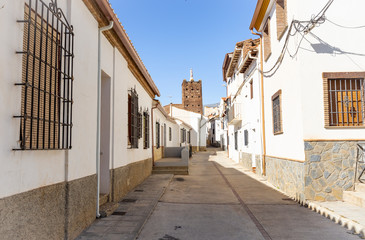 a street in Jerez del Marquesado town with typical white houses, province of Granada, Andalusia,...