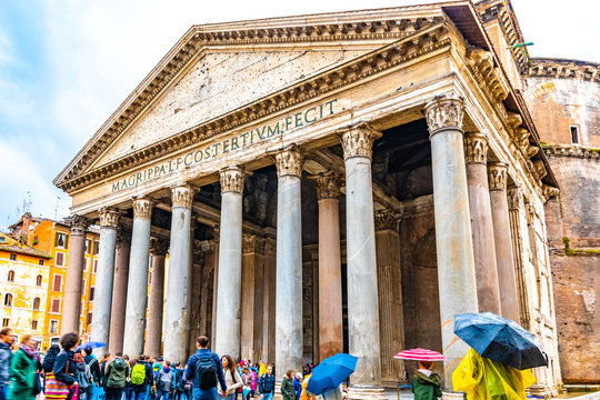 Rome, Italy. Tourists at the Pantheon, a Catholic Church, former Roman temple in Piazza Della Rotonda. Historical cylindrical building with granite Corinthian columns on the portico