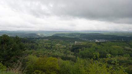 Cloudy panoramic view of the landscape of the Stavropol territory. View of fields, forests, city in the distance
