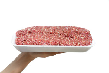 Minced beef in foam plates on hand with isolated white