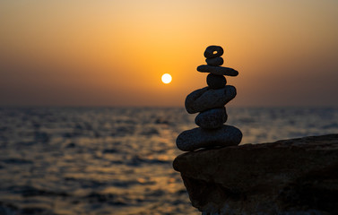 Zen concept. Sunset. The object of the stones on the beach at sunset.  Relax & Meditation. Zen stones.