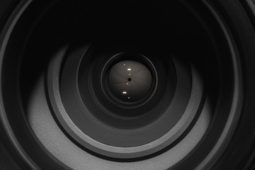 Camera lens on black background. Aperture blades. Camera lens close up.