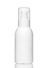 White cosmetic bottle with dispenser and transparent cap isolated on a white background